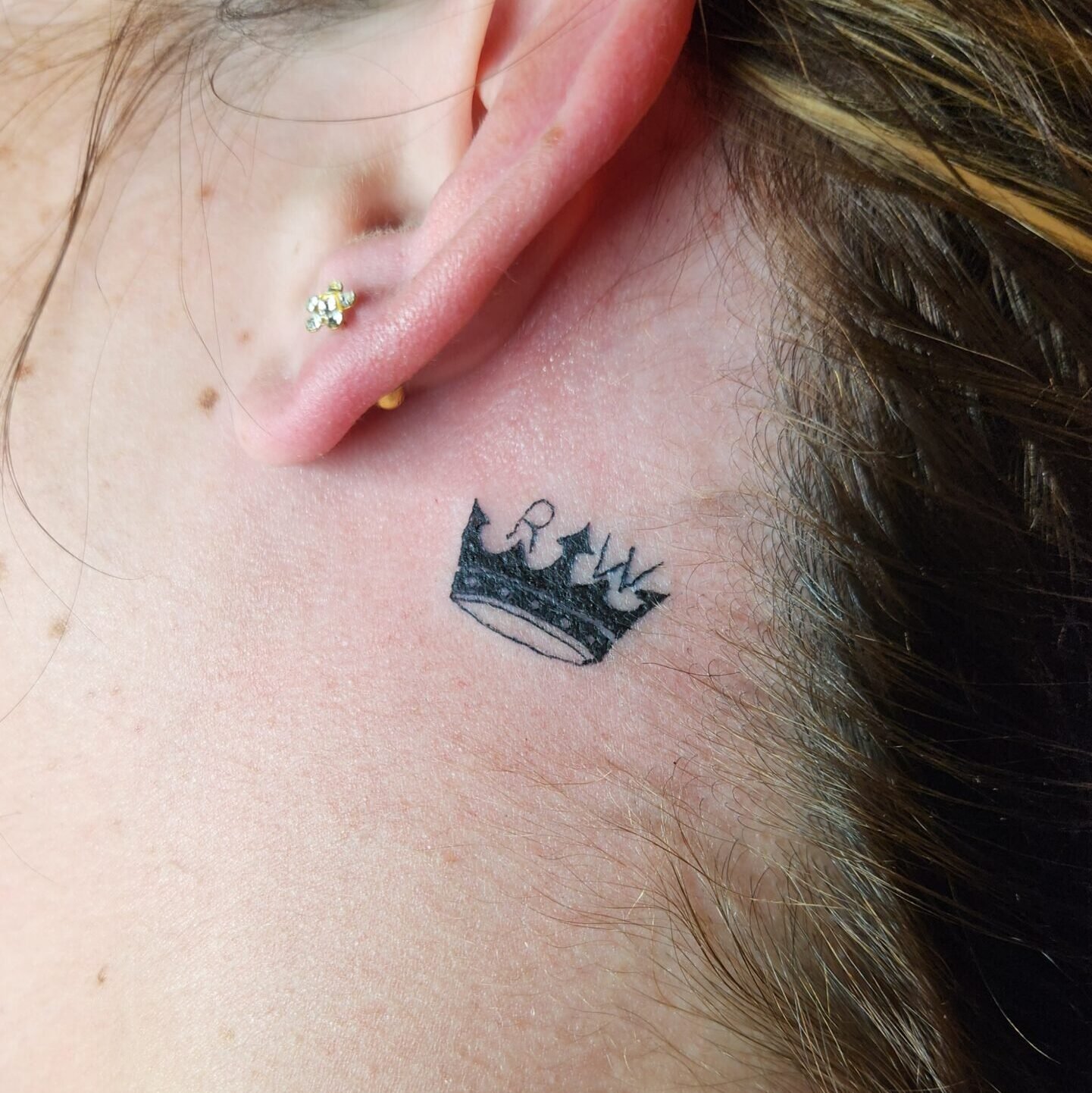 Small Crown Tattoo Behind the Ear